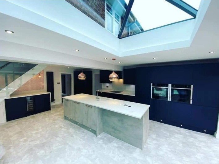 Kitchen with roof lantern and recessed lighting